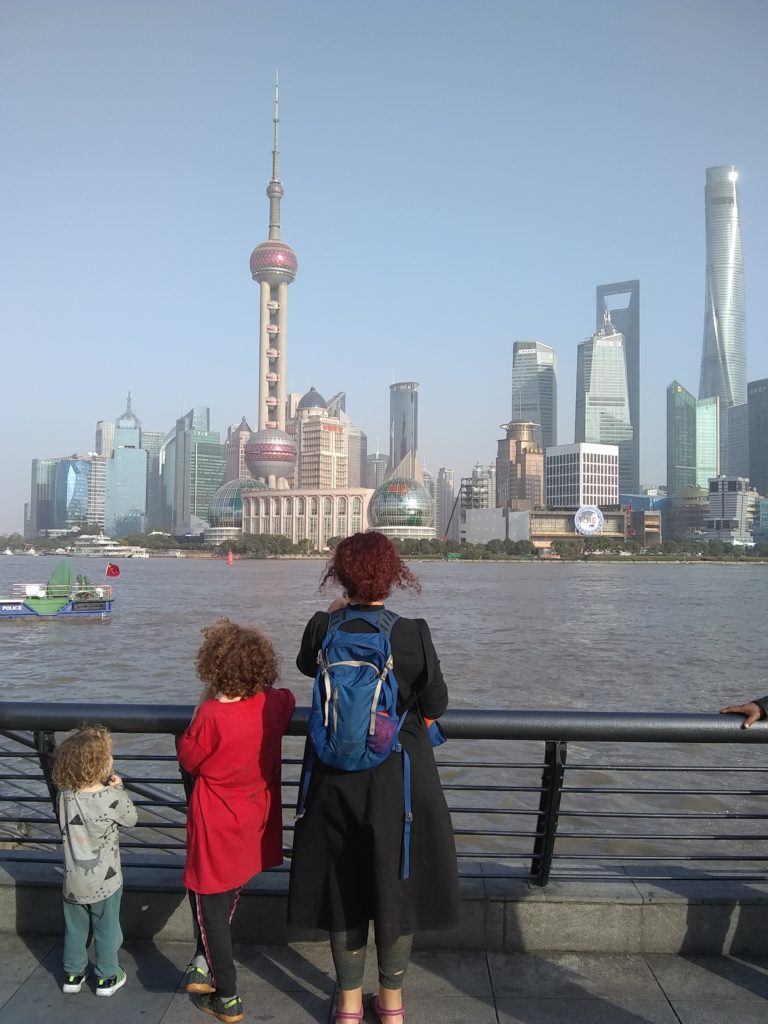 Family looking a the Bund in Shanghai in China
