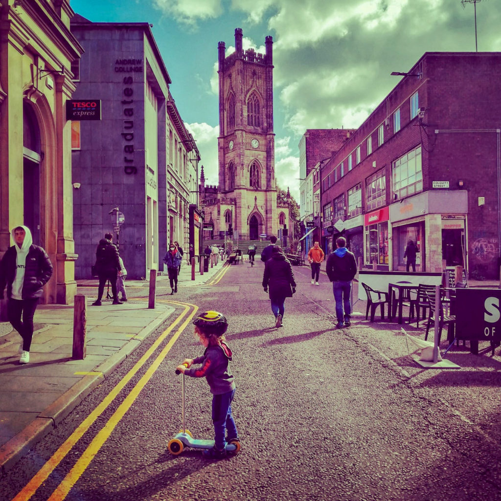 Child on Bold Street Liverpool with St John's Church in Background