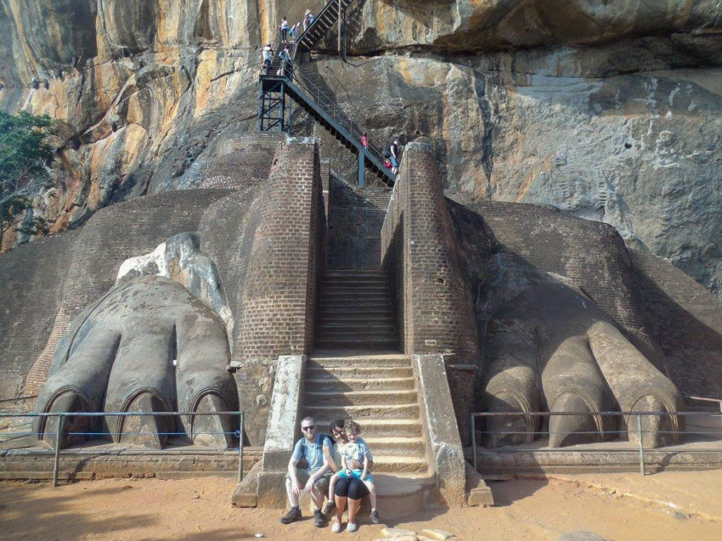 Family sitting at Lion Feet at Sigiriya Rock in Sri Lanka