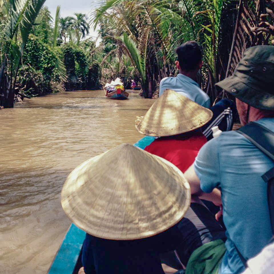 Children on boat on Mekong River in Vietnam