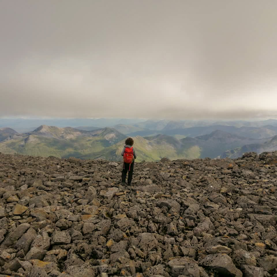 Child looking out from the top of Ben Nevis