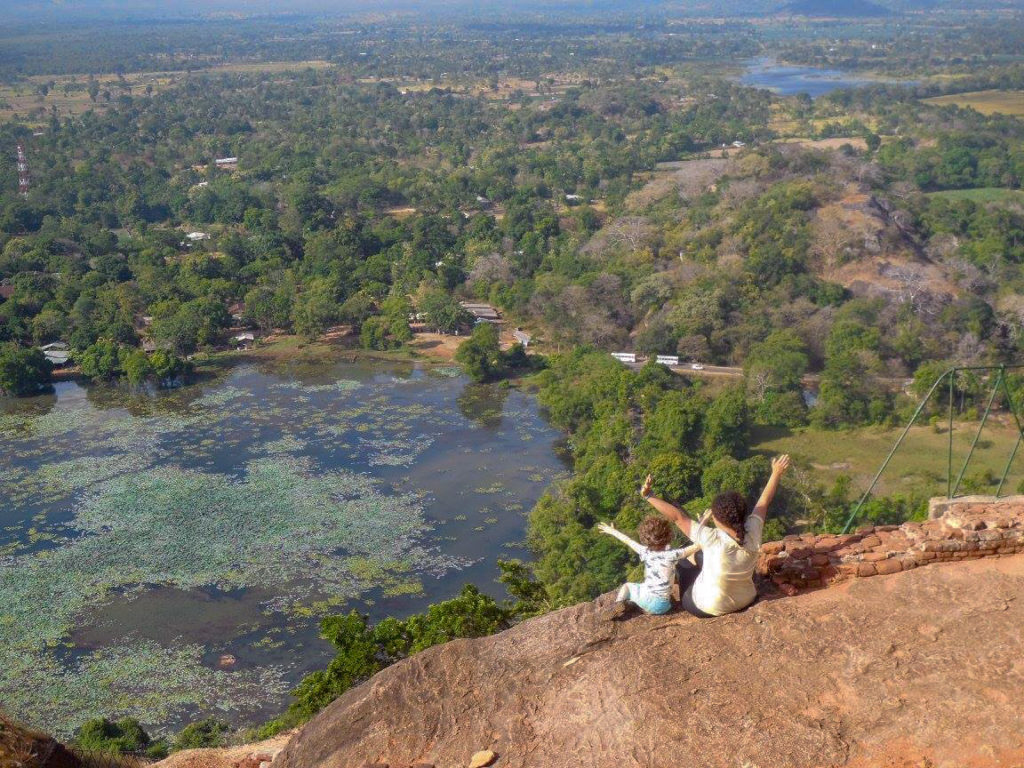Mother and Child looking out at the top of Sigiriya Rock in Sri Lanka
