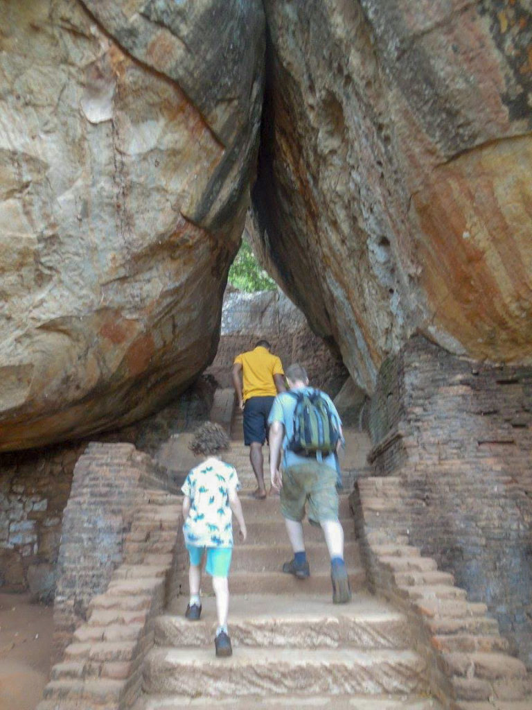 Child and Father walking into Sigiriya Rock