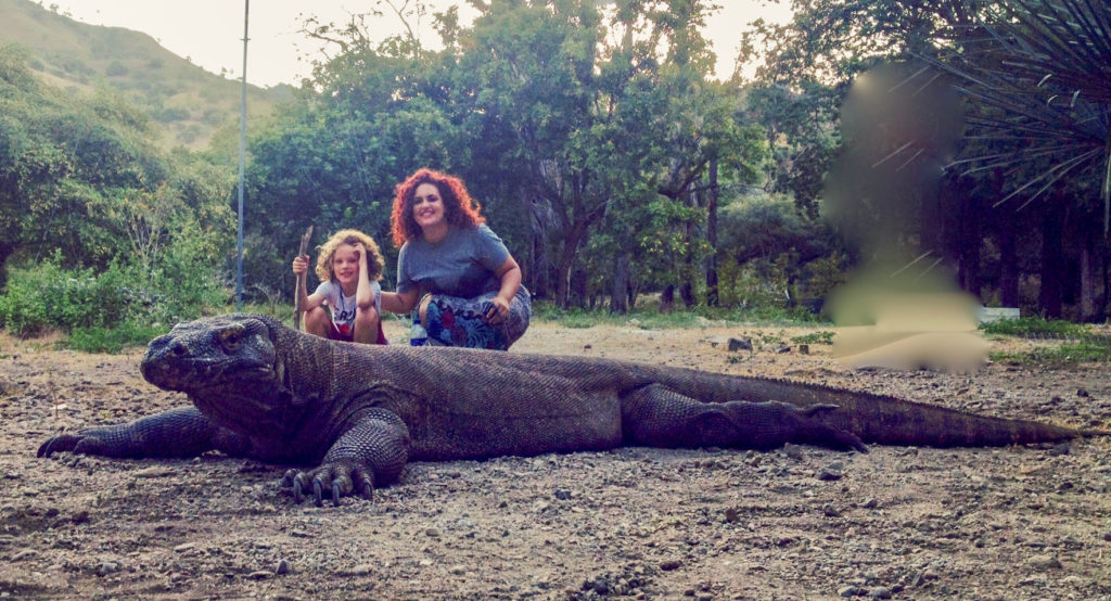 family next to Komodo Dragon in Indonesia