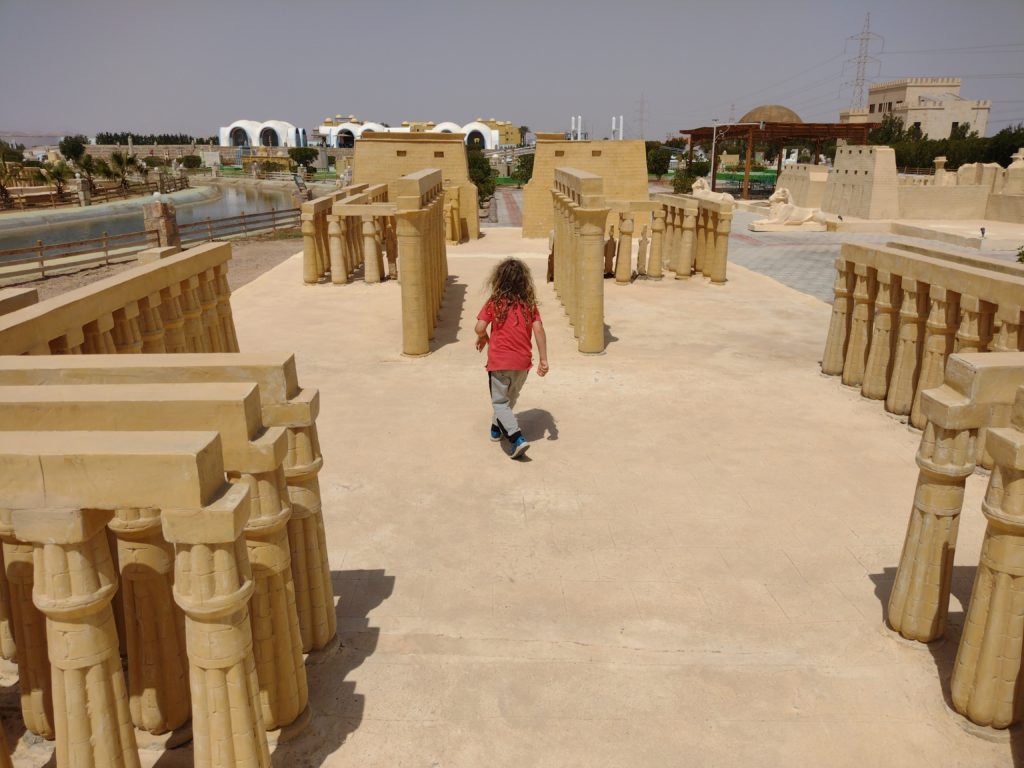 Child walking through miniature model in Mini Egypt Hurghada