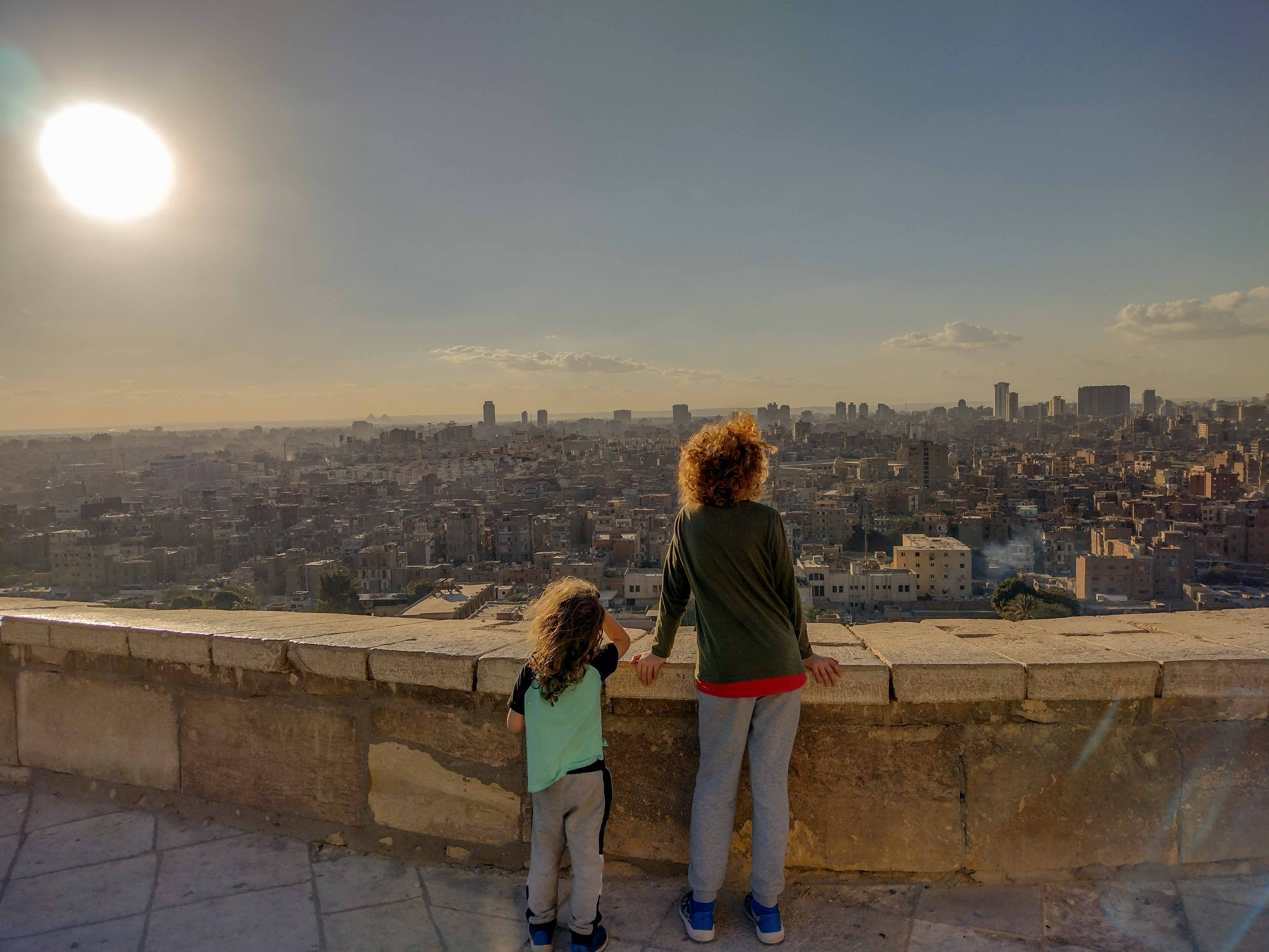 two children looking out form the Citadel over Cairo, Egypt