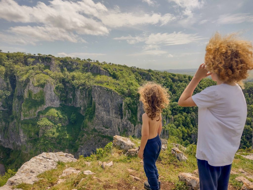 Two Children stood on Cliff Walk overlooking Cheddar Gorge