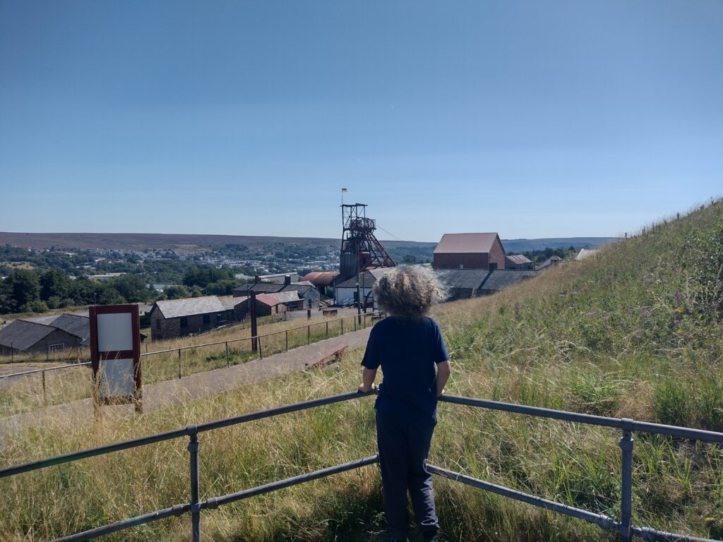 Child overlooking Big Pit Coal Museum in Wales