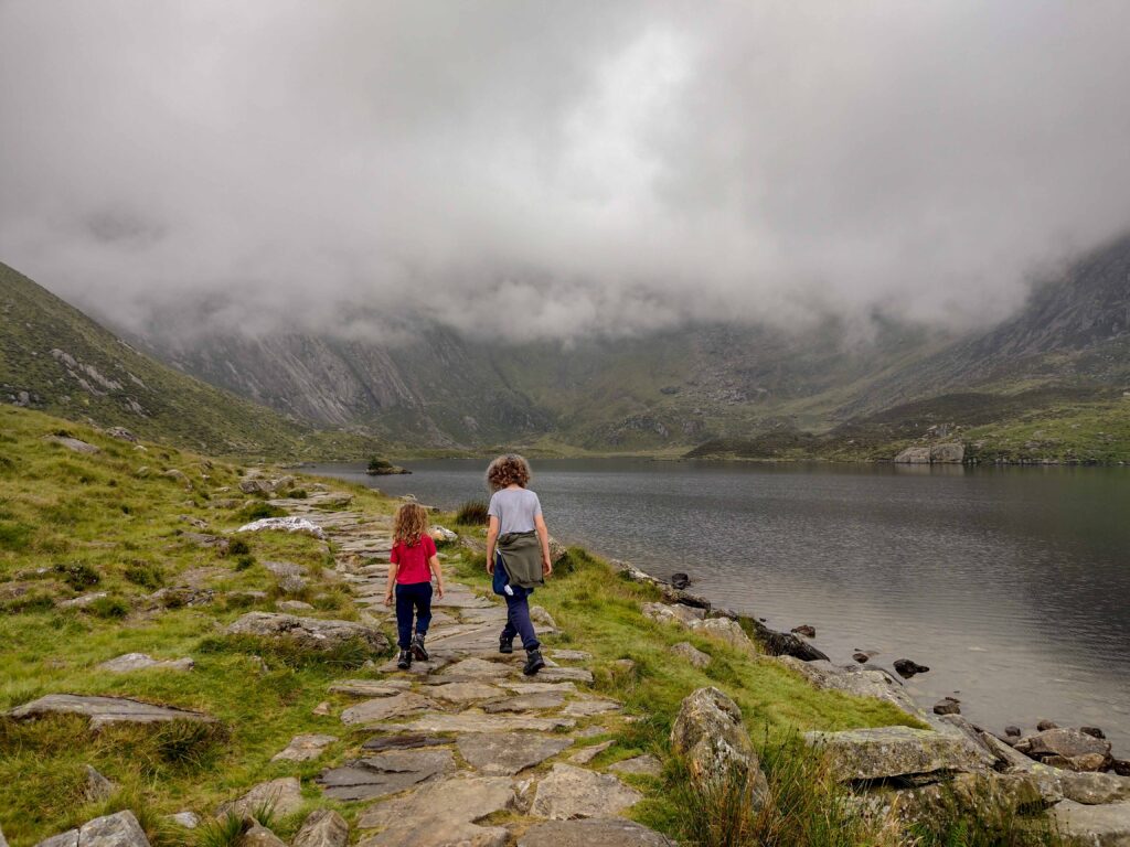 Two Children walking around Lake in Wales
